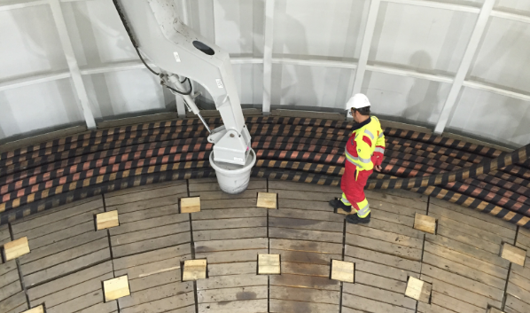 Man standing on an under deck carousel
